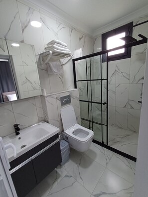 Jetted bath, hair dryer, towels, soap