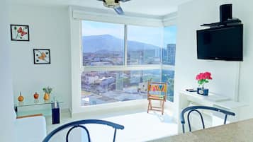 Standard Apartment, City View | Living area | LED TV