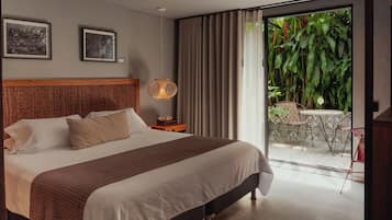 Design Suite, 1 King Bed, Patio | Minibar, in-room safe, individually decorated, desk