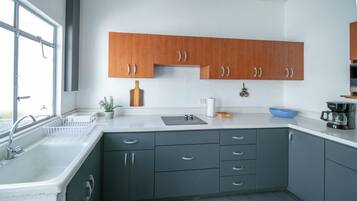 Fridge, microwave, stovetop, coffee/tea maker