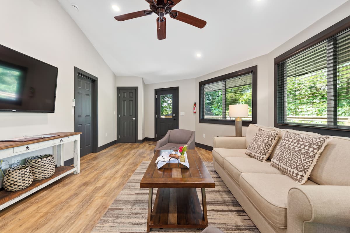 Tree Top Village at Springdale Resort | Living area | 50-inch LED TV with cable channels