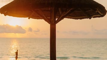 On the beach, sun-loungers, beach towels