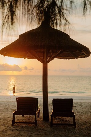 On the beach, sun-loungers, beach towels