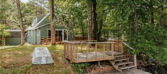 Cozy lakeside cottage with modern furniture on a quiet street.