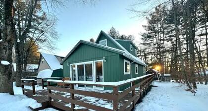 Cozy lakeside cottage with modern furniture on a quiet street.