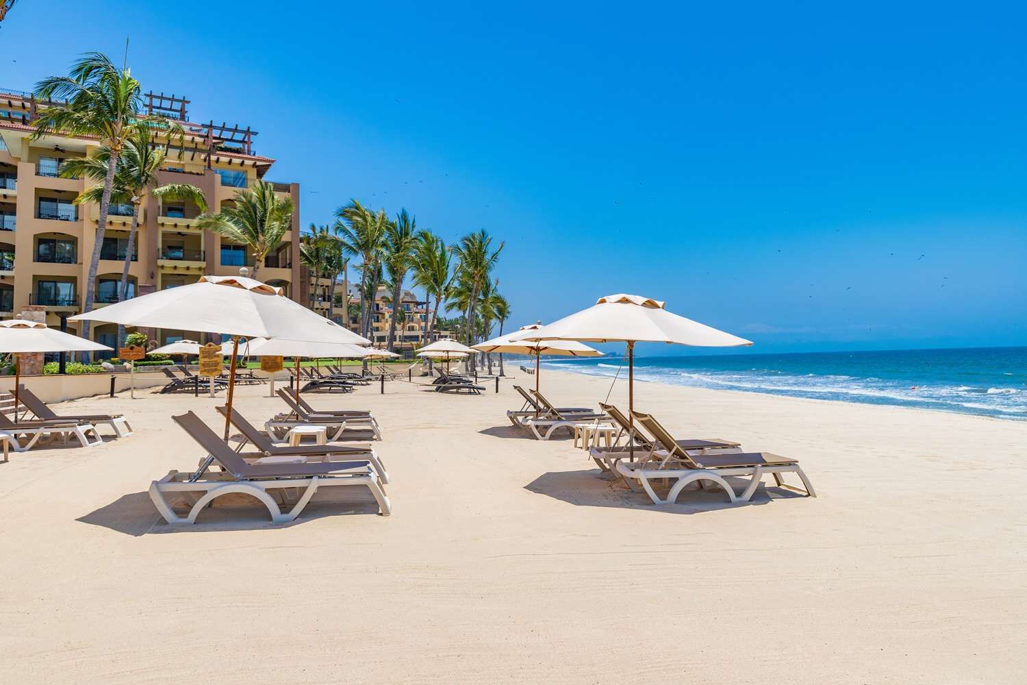 On the beach, sun-loungers, beach towels