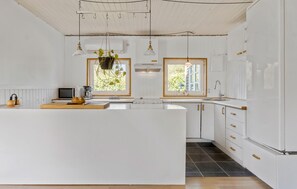 Fridge, stovetop, dishwasher, coffee/tea maker
