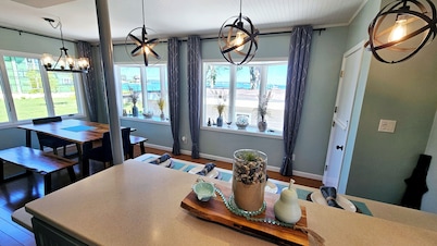 Lakefront cottage on Muskegon Lake! Fire pit, 40' BOAT DOCK, near beach, shops