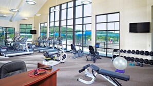 A gym with cardio machines, free weights, and a desk with exercise equipment. - 4 BR. Hot Tub. Pet Friendly. May Discounts! (Galena)