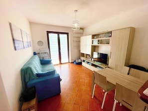 Apartment, 1 Bedroom, Balcony, Garden View | Living room - Marefuori - Porto Santo Stefano (Monte Argentario)