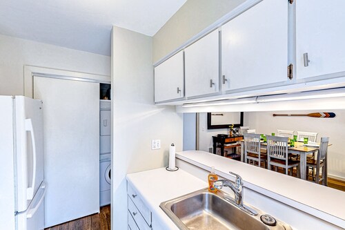 Riverfront condo with lake access, views, deck, washer/dryer, community firepit