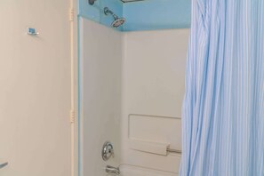 Shower, hair dryer, towels, shampoo
