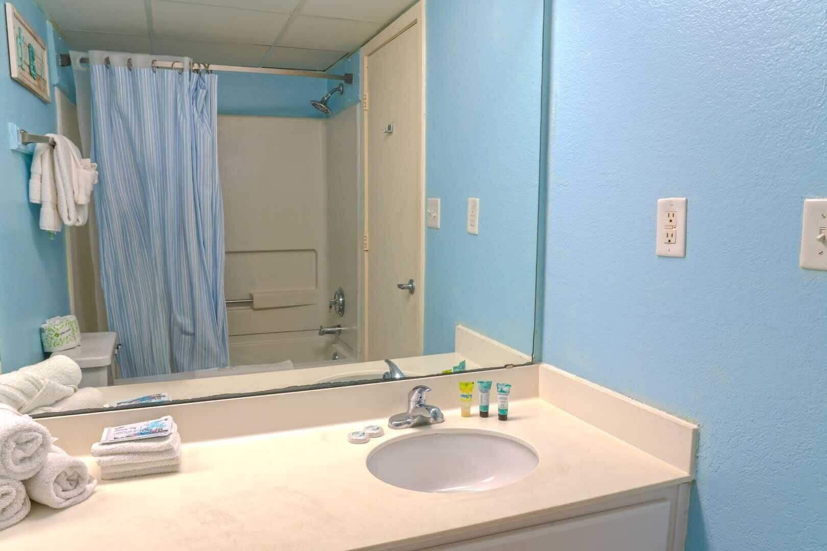Shower, hair dryer, towels, shampoo