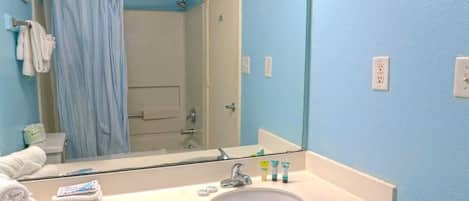 Shower, hair dryer, towels, shampoo