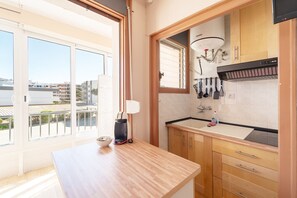 Fridge, microwave, coffee/tea maker, cookware/dishes/utensils