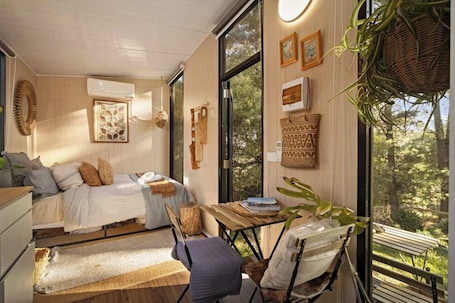 1 bedroom, bed sheets. Tiny Zahalka House by Tiny Away