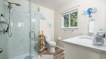 Shower, hair dryer, towels, shampoo
