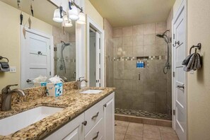 Shower, hair dryer, towels, shampoo