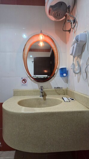 Combined shower/tub, hair dryer, towels, soap