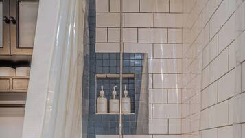 Shower, hair dryer, towels, shampoo