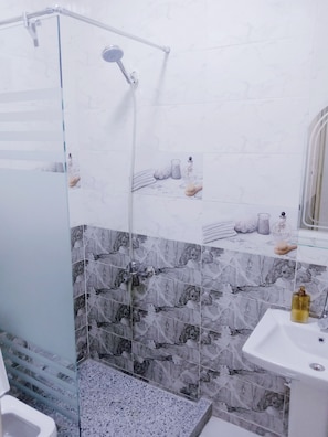 Shower, hair dryer, towels, soap