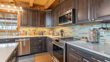 Dishwasher, coffee/tea maker, cookware/dishes/utensils, dining tables