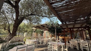 Breakfast, lunch, dinner served; local cuisine, garden views