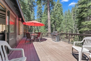 Enjoy al fresco dining on the deck with a barbecue grill and comfortable seating.
