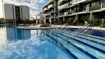 8 indoor pools, open 8:00 AM to 10:00 PM, pool umbrellas, pool loungers