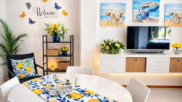 Apartment, Garden View | Living area | 26-inch Smart TV with digital channels