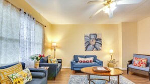 A living room with two sofas, a coffee table, and a painting on the wall. - Cozy East Pittsburgh Home - 7 Mi to Frick Park! (East Pittsburgh)
