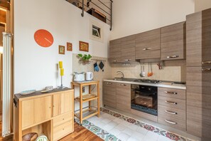 Fridge, oven, electric kettle, cookware/dishes/utensils