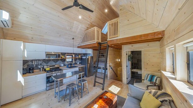 A modern cabin interior with a kitchen, dining area, and living space. - Walkable Studio in Downtown Bar Harbor [Sea Smoke] (Bar Harbor)