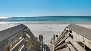 A wooden staircase leading to a beach with a clear view of the ocean. - Pool, Splash Pad & Hot Tub, Private Balcony, Close to Beach (Miramar Beach)