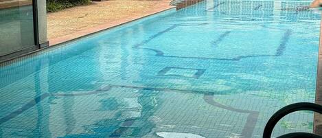 Outdoor pool, a heated pool, pool umbrellas, sun loungers