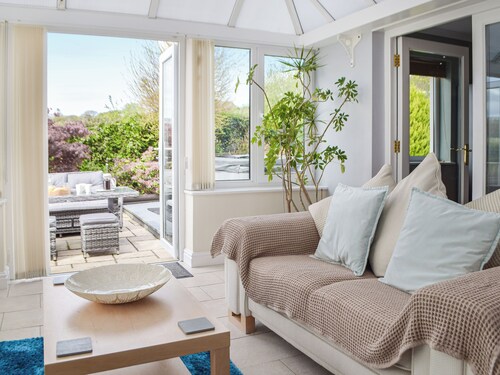 A spacious holiday home with a heavenly hot tub close to stunning beaches.