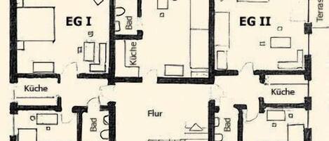 Plano de planta con dos dormitorios (EG I y EG II), dos cocinas, un salón (Flur) y una terraza.