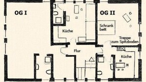 Un plan d’étage comprenant deux chambres (OGI et OGII), une salle de bain, une cuisine, un coin repas et un salon.