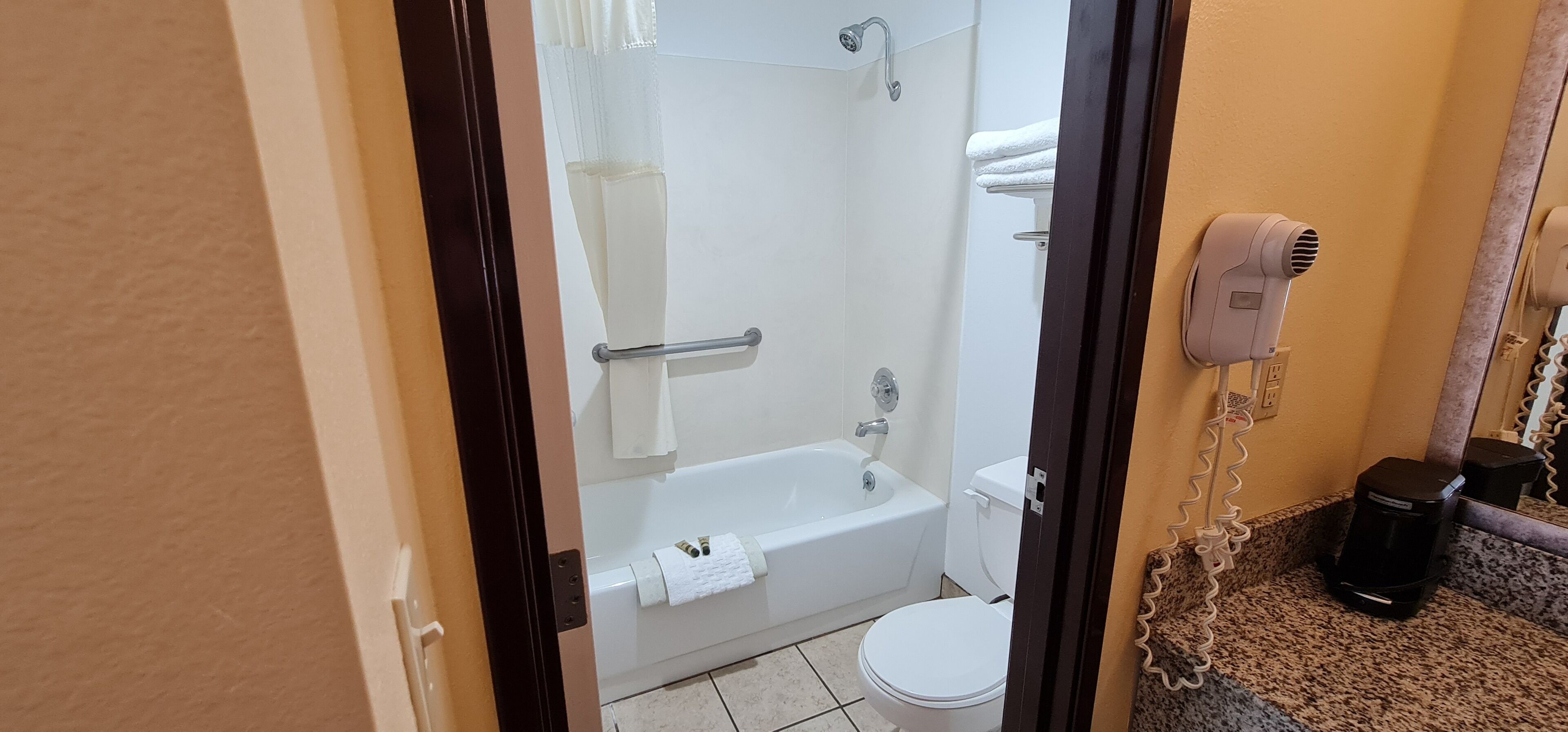 Hair dryer, towels, soap, shampoo