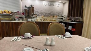A breakfast buffet area with a variety of food items and a coffee station. - Rue d'Or (Setif)