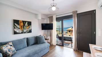 Superior Studio Suite | Living area | 43-inch Smart TV with digital channels, streaming services