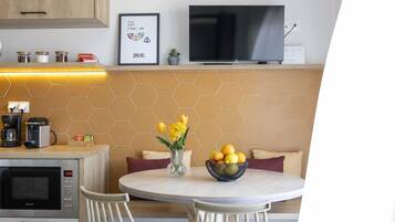 Deluxe Apartment, Sea View | Living area | 43-inch Smart TV with digital channels, streaming services