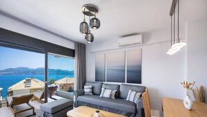 Comfort Apartment | Living area | 43-inch Smart TV with digital channels, streaming services - The Bee Apartments Sea View (Lefkada)