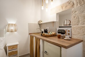 Fridge, microwave, stovetop, coffee/tea maker