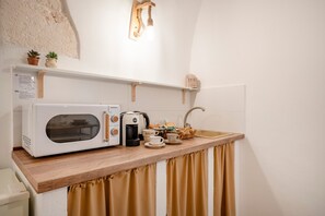 Fridge, microwave, stovetop, coffee/tea maker