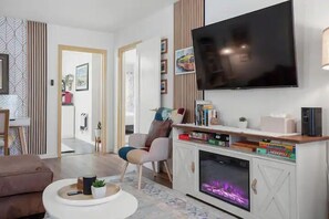 Deluxe Apartment, 2 Bedrooms, Private Bathroom, Beachside | Living area | 55-inch flat-screen TV with digital channels