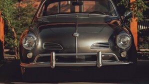 A vintage car parked in front of a building with a sign above it. - Best Bet Motor Lodge  (Reno)