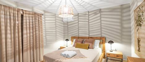 A modern bedroom with a large bed, wooden headboard, and a ceiling light fixture.