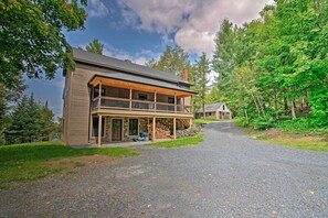 Woodland Vista: Where the Cabin`s Front View Frames Nature`s Canvas
