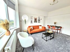 Comfort House, Multiple Beds, Non Smoking, Garden View | Living area | 50-inch Smart TV with digital channels